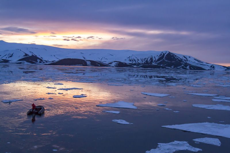 Small boat among ice floes
